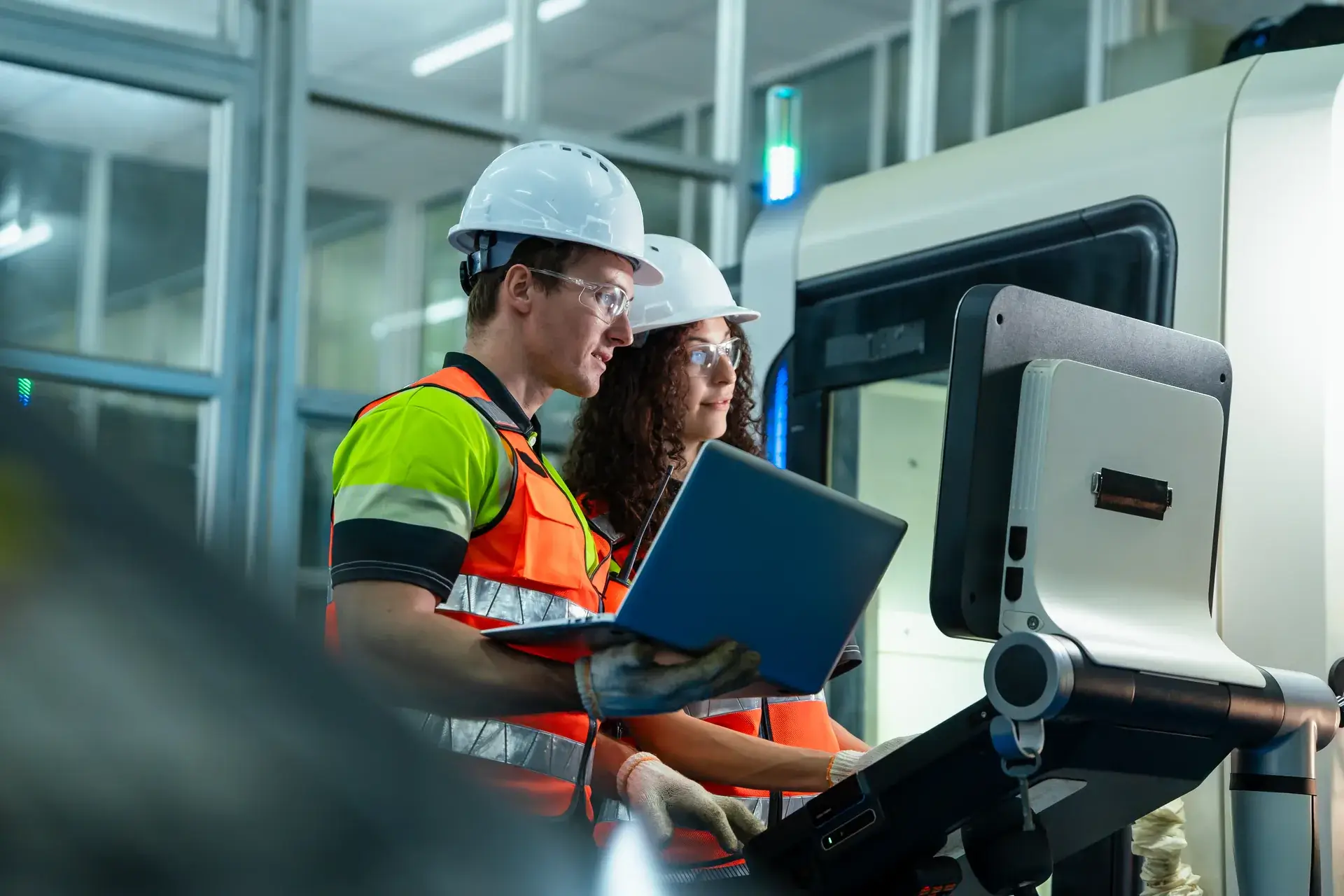 Technicians in an industrial workshop managing production with Synoptic ERP